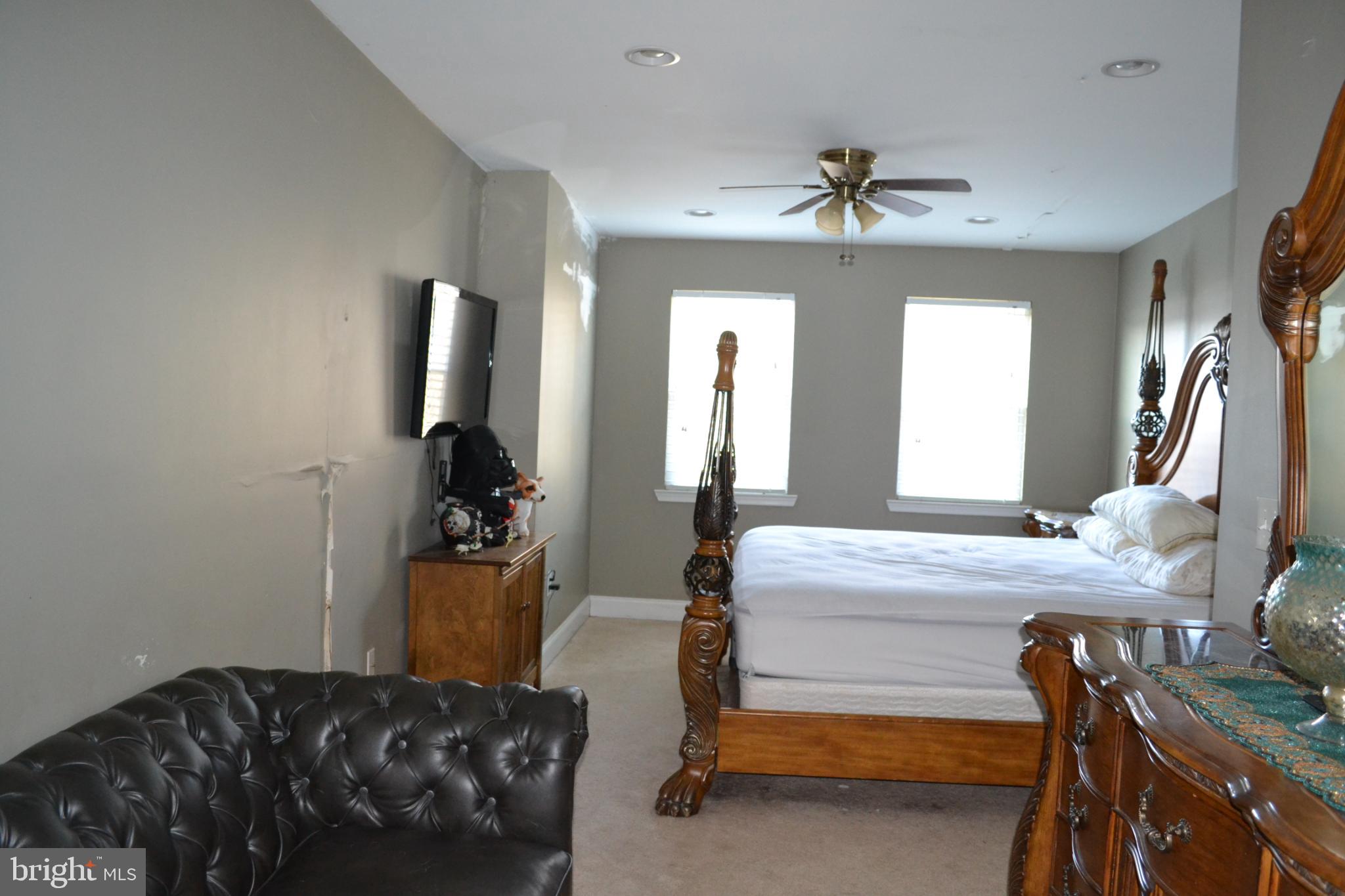 1410 North Bond Street Baltimore, MD 21213 - Photo 14 of 26 a bedroom with furniture and a chandelier