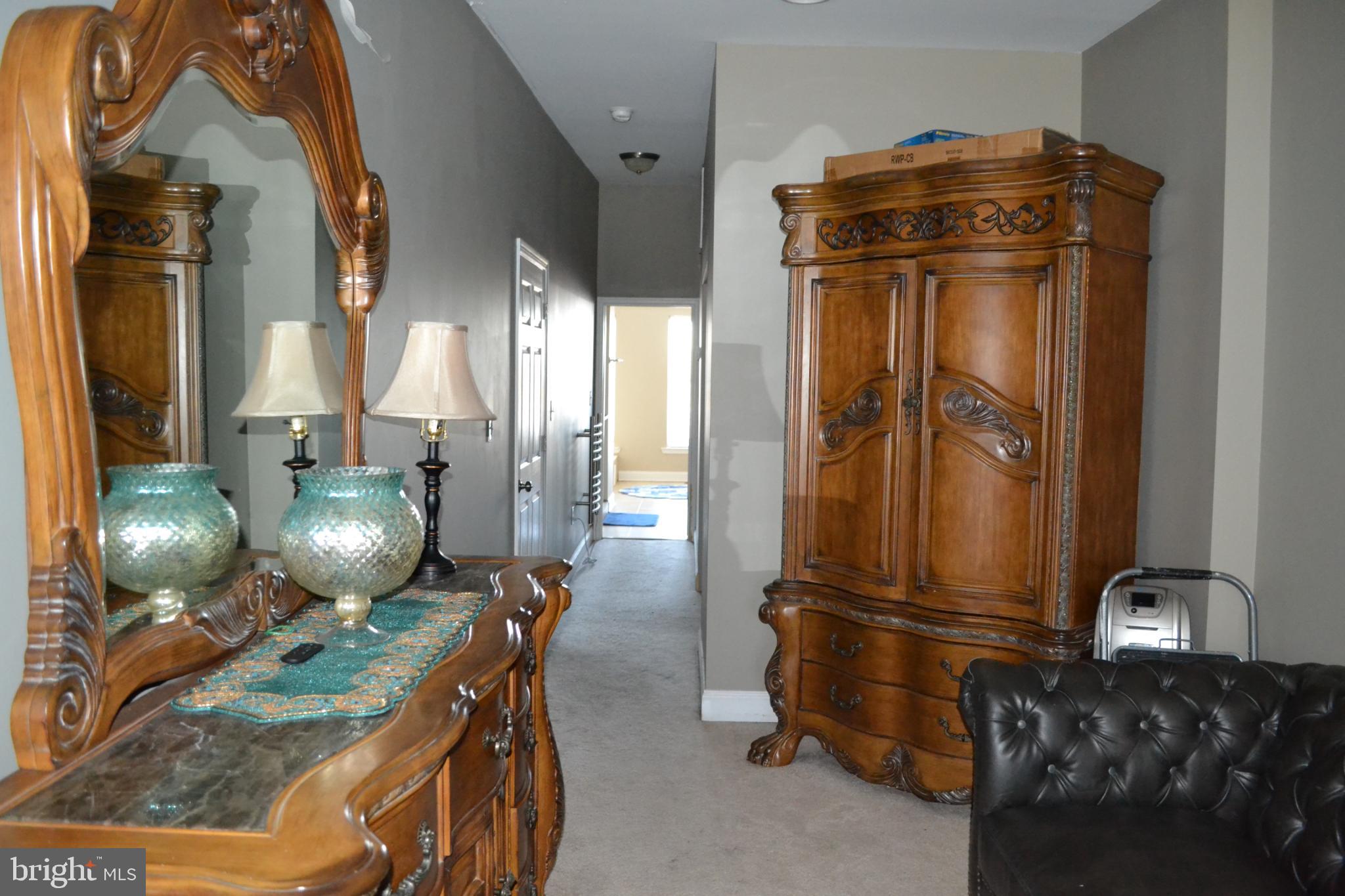 1410 North Bond Street Baltimore, MD 21213 - Photo 15 of 26 a bathroom with a mirror and shower