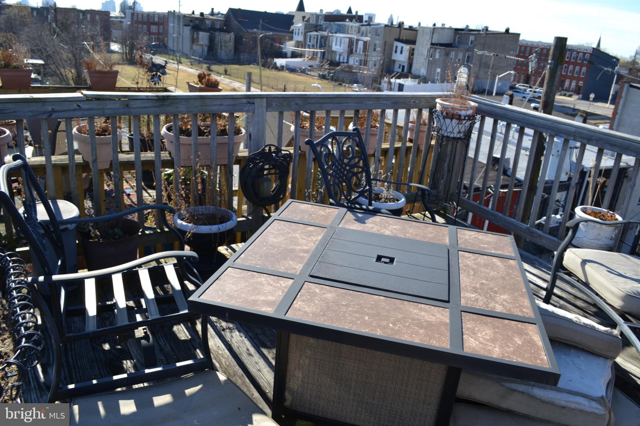1410 North Bond Street Baltimore, MD 21213 - Photo 24 of 26 a view of a balcony with wooden floor and outdoor seating