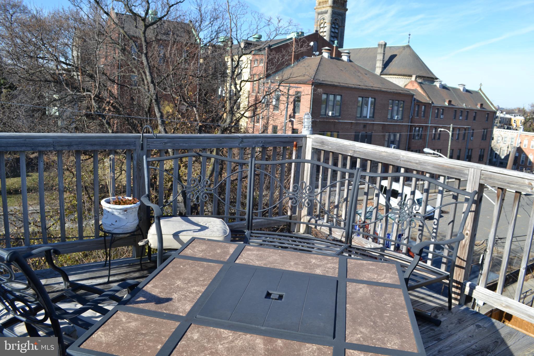1410 North Bond Street Baltimore, MD 21213 - Photo 25 of 26 a view of a balcony with wooden floor