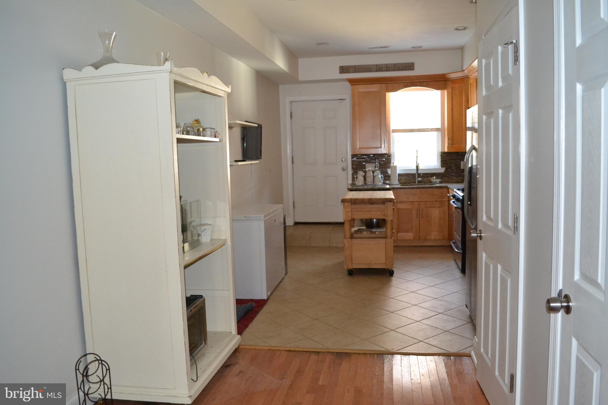 1410 North Bond Street Baltimore, MD 21213 - Photo 6 of 26 a kitchen with a refrigerator and a stove