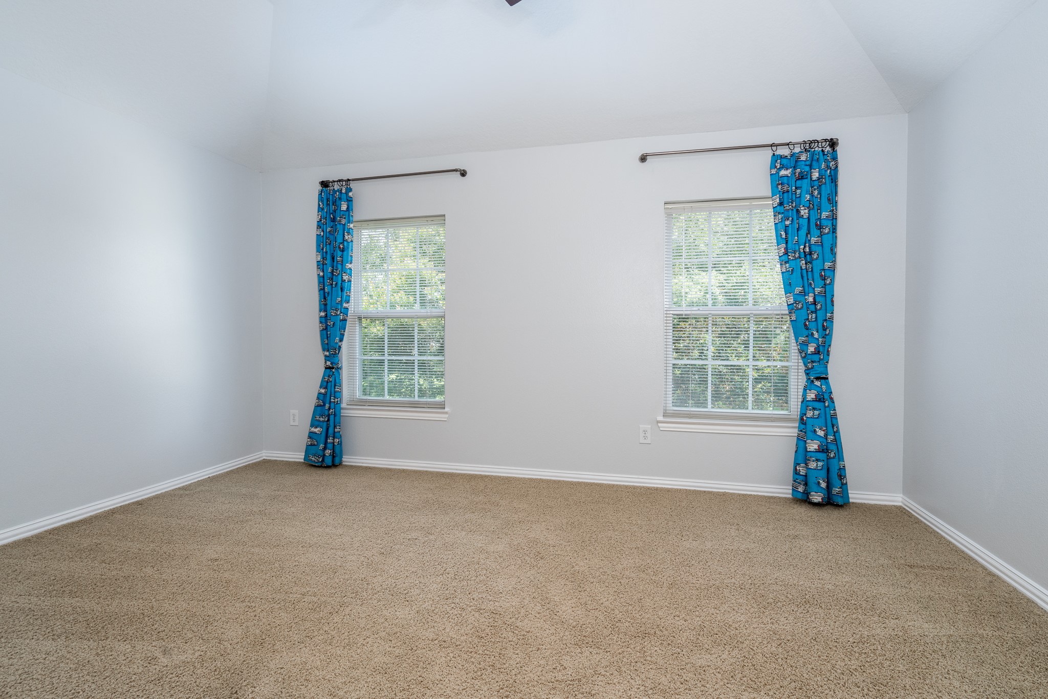 5914 Oakmoss Trail Spring, TX 77379 - Photo 21 of 50 Each of the secondary bedrooms in this home, has their own character and charm! A fabulous tree view of the neighborhood greenspace shines through into this room!