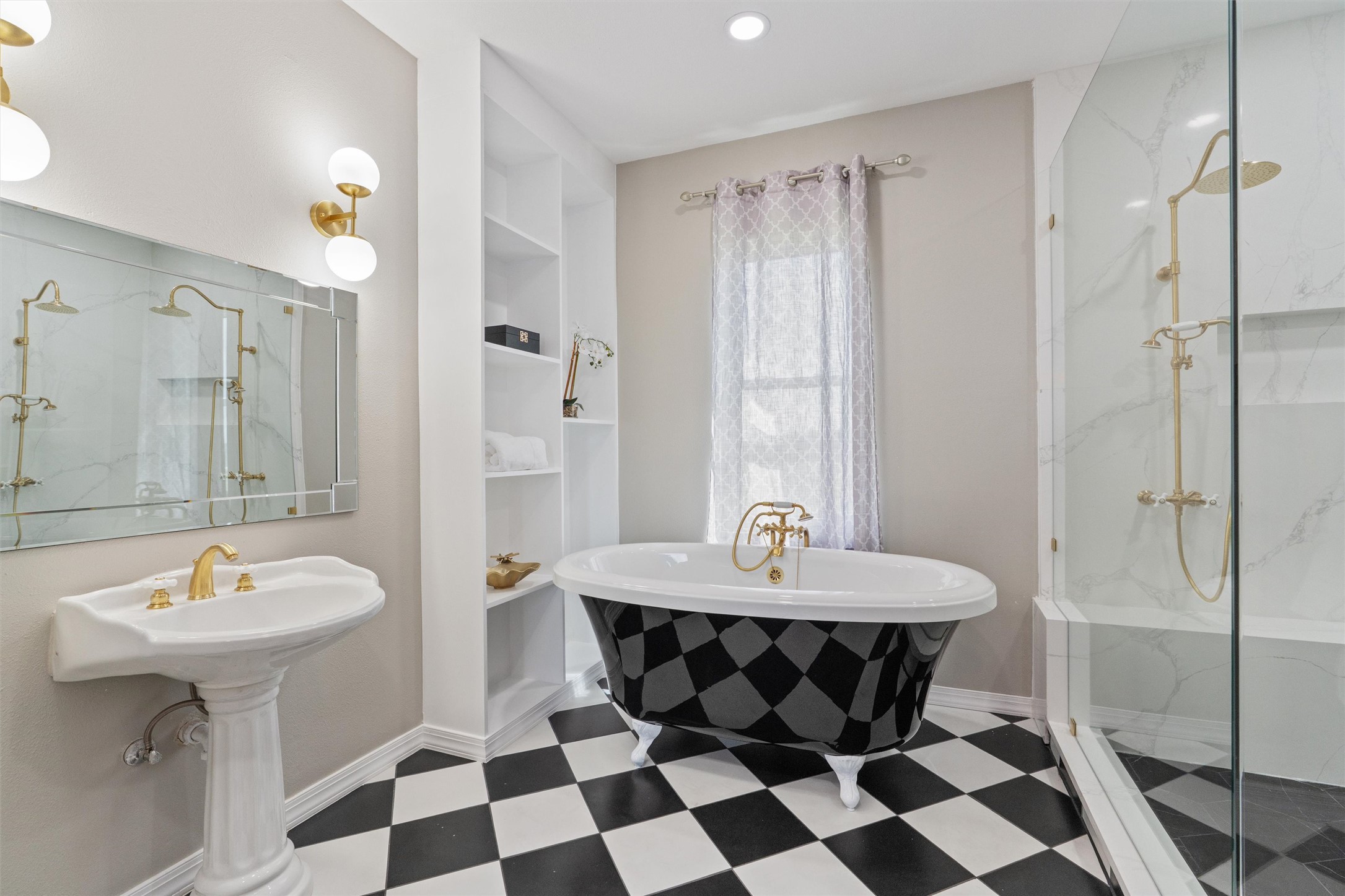 768 Upper Elgin River Road Elgin, TX 78621 - Photo 22 of 40 Primary suite- Kingston and Brass fixtures on claw foot tub, oversized shower, sink.