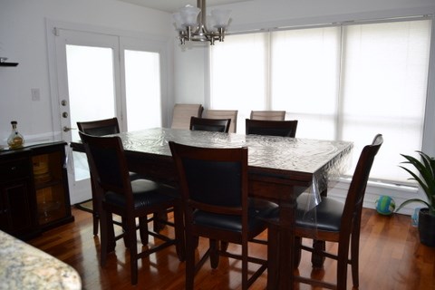 241 Lake Oaks Boulevard Coldspring, TX 77331 - Photo 2 of 16 a view of a dining room with furniture and window
