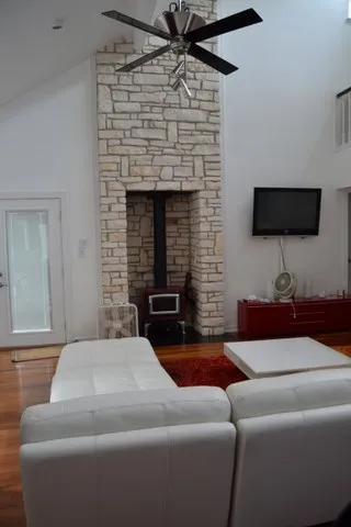 a living room with furniture and a fireplace