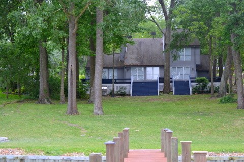 241 Lake Oaks Boulevard Coldspring, TX 77331 - Photo 9 of 16 a backyard of a house with seating space