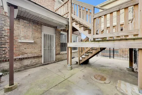 a view of a balcony with furniture