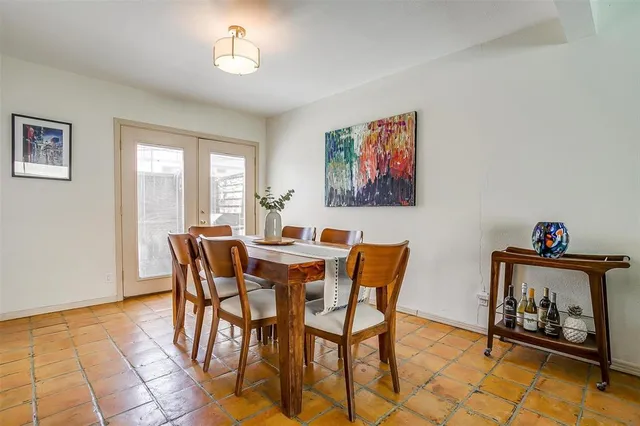 a view of a dining room with furniture and a window