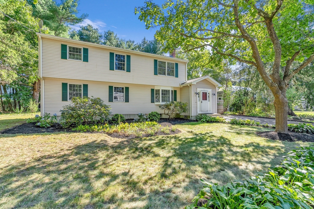 35 Arrowhead Road Concord, MA 01742 - Photo 1 of 23 a front view of a house with a yard