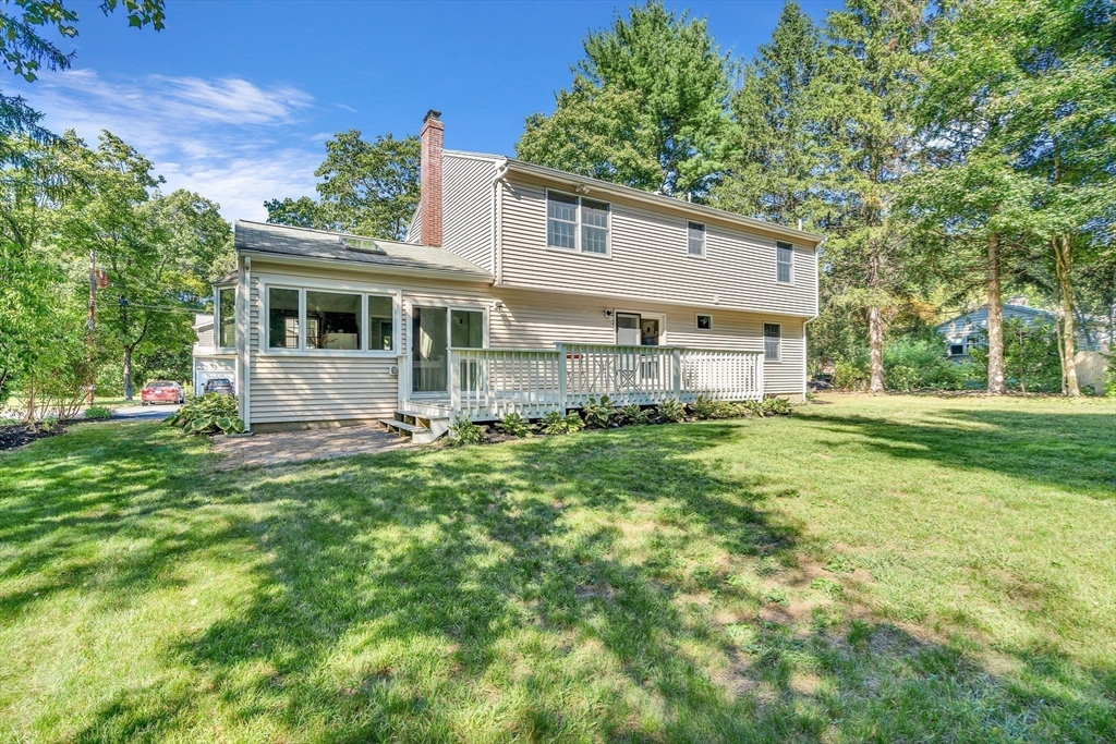 35 Arrowhead Road Concord, MA 01742 - Photo 22 of 23 a front view of house with yard and green space