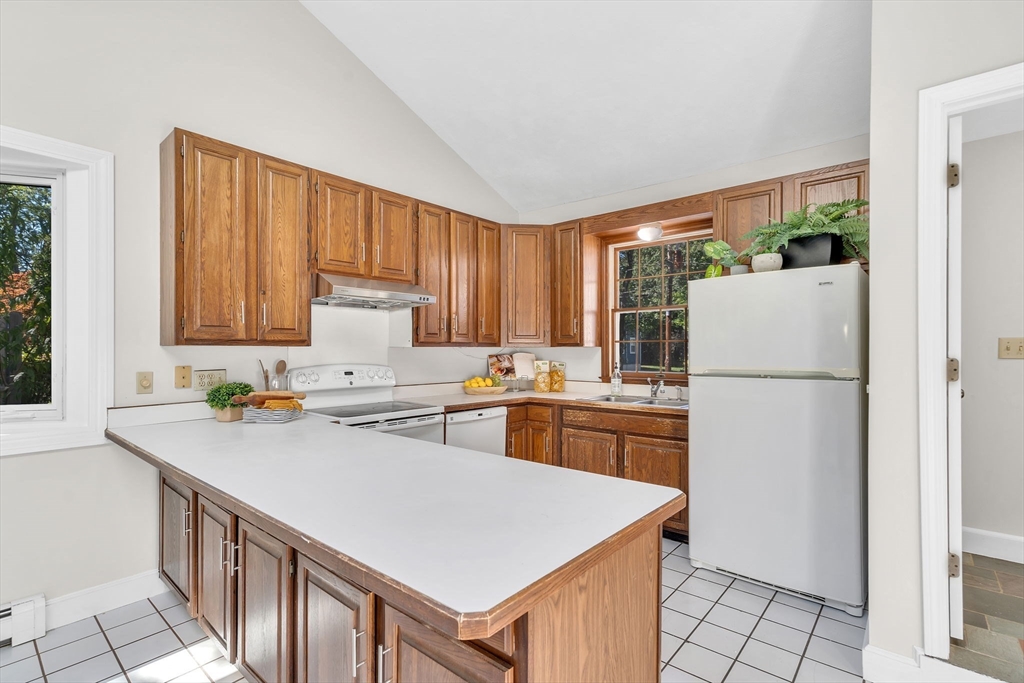 35 Arrowhead Road Concord, MA 01742 - Photo 7 of 23 a kitchen with a refrigerator a stove a sink dishwasher and a refrigerator