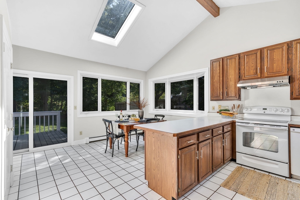 35 Arrowhead Road Concord, MA 01742 - Photo 8 of 23 a kitchen with a stove a sink and a refrigerator
