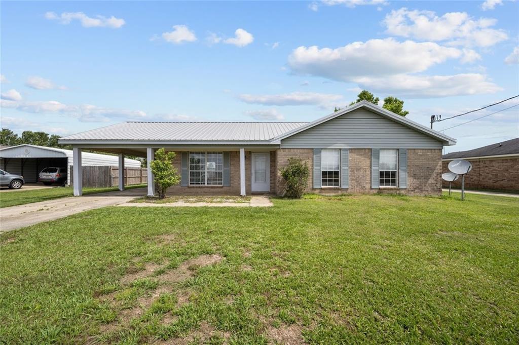 18965 Fairground Road Robertsdale, AL 36567 - Photo 1 of 1 a front view of a house with a garden
