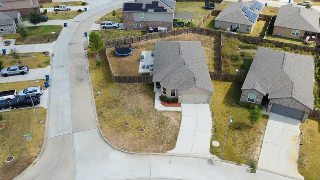an aerial view of a highlighted house