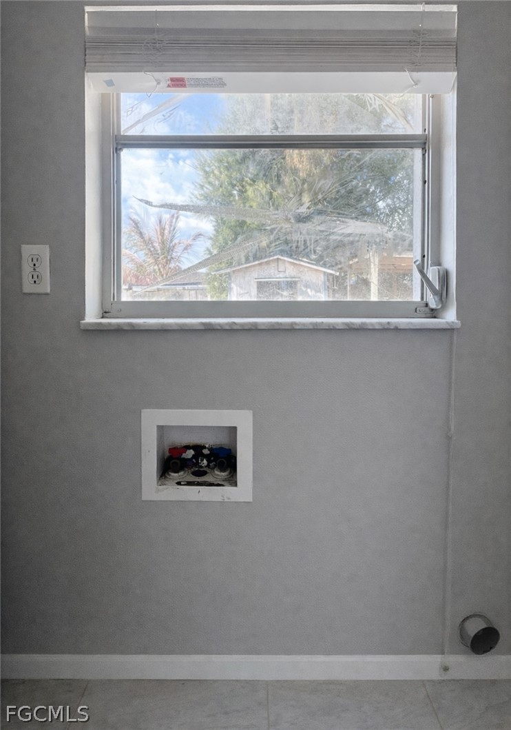 424 Cactus Circle Lehigh Acres, FL 33936 - Photo 16 of 18 a view of wooden floor and a window