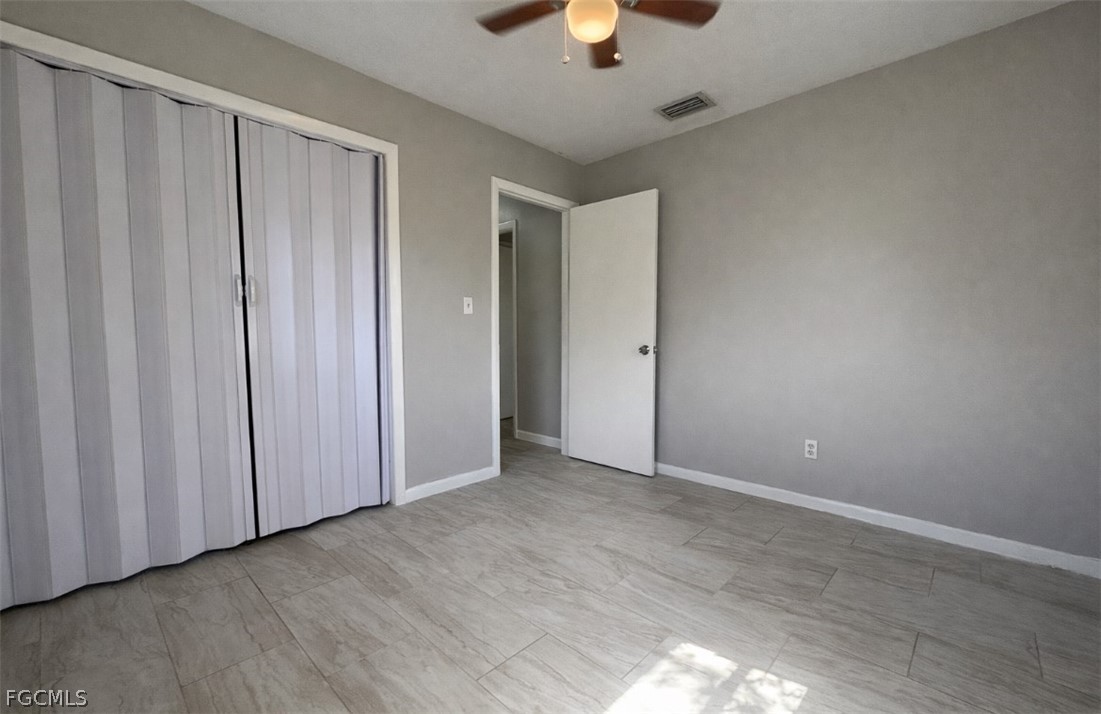 424 Cactus Circle Lehigh Acres, FL 33936 - Photo 9 of 18 wooden floor in an empty room