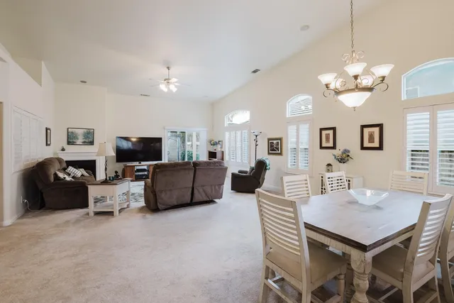 a view of a livingroom with furniture and a flat screen tv