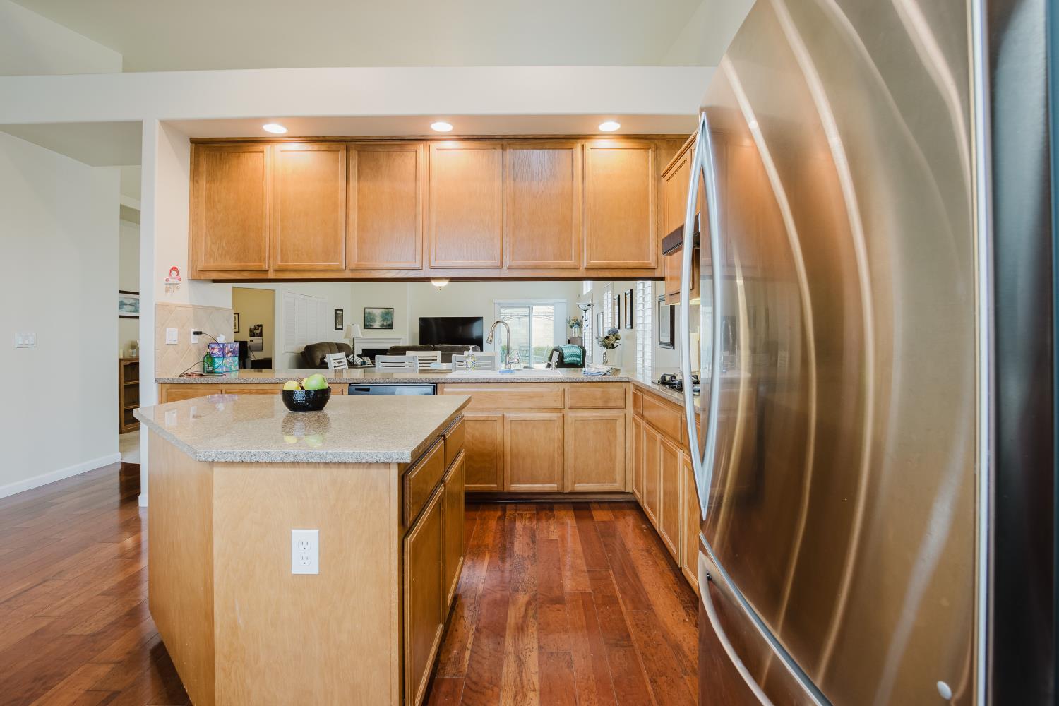 1634 Judith Way Escalon, CA 95320 - Photo 12 of 40 a living room with a large window and a wooden floor