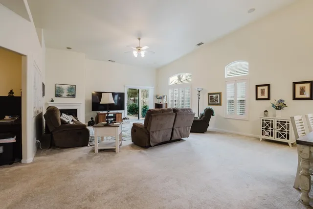 a living room with furniture cabinets and a flat screen tv