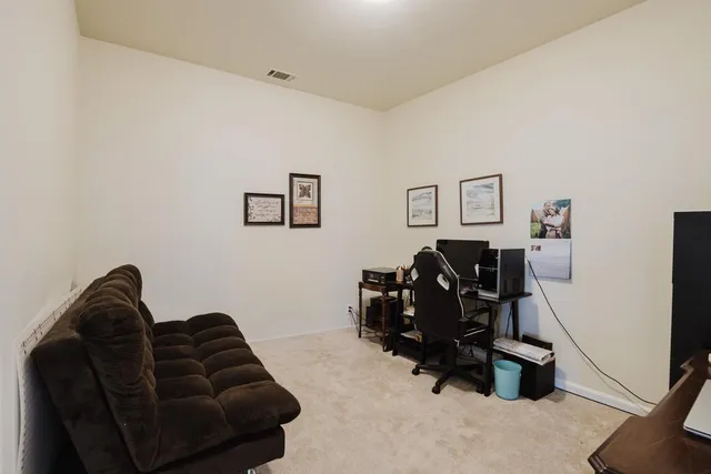 a view of workspace with a couch