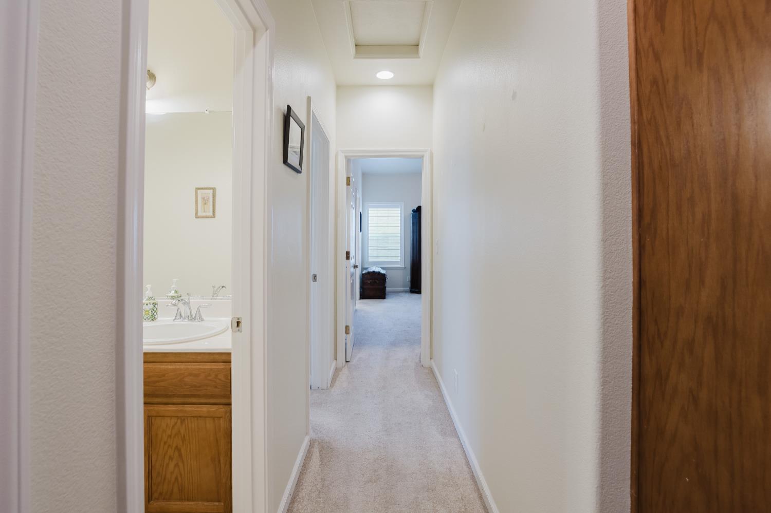 1634 Judith Way Escalon, CA 95320 - Photo 23 of 40 a view of a bathroom from a corridor