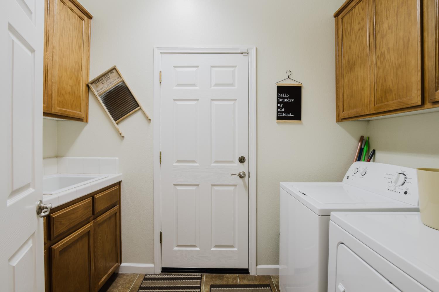 1634 Judith Way Escalon, CA 95320 - Photo 24 of 40 a utility room with dryer and washer