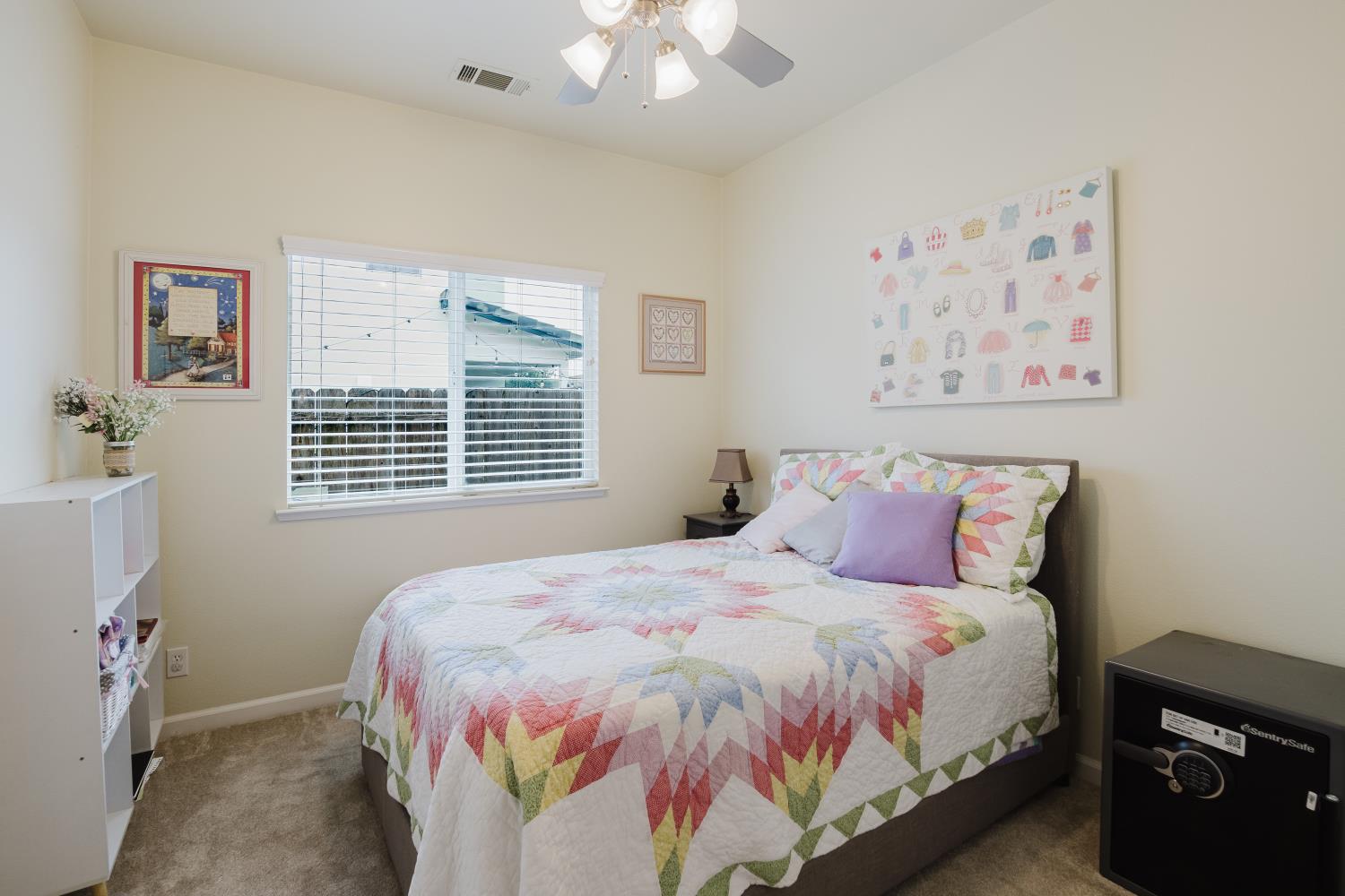 1634 Judith Way Escalon, CA 95320 - Photo 27 of 40 a bed sitting in a bedroom next to a window