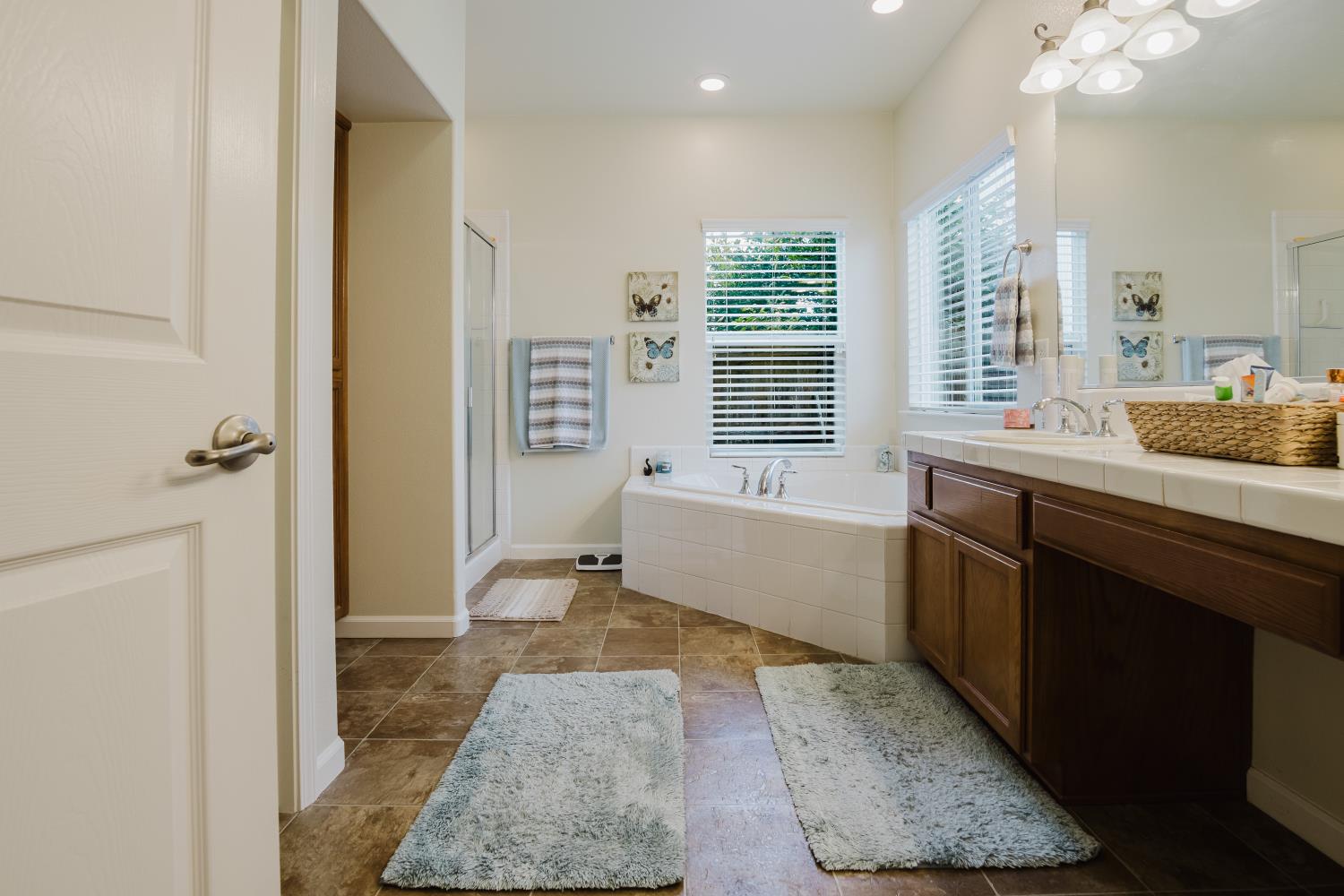 1634 Judith Way Escalon, CA 95320 - Photo 31 of 40 a bathroom with a granite countertop sink a toilet and shower