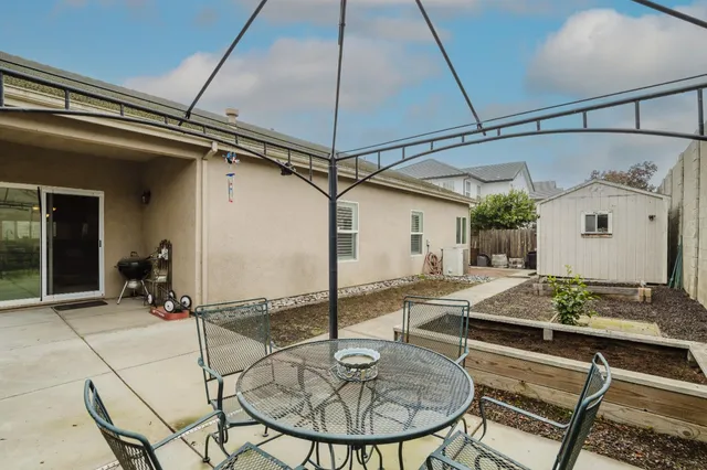 a dinning table and chairs in a patio