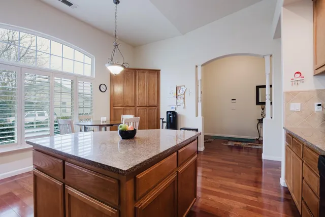 a kitchen with a stove a sink and a refrigerator