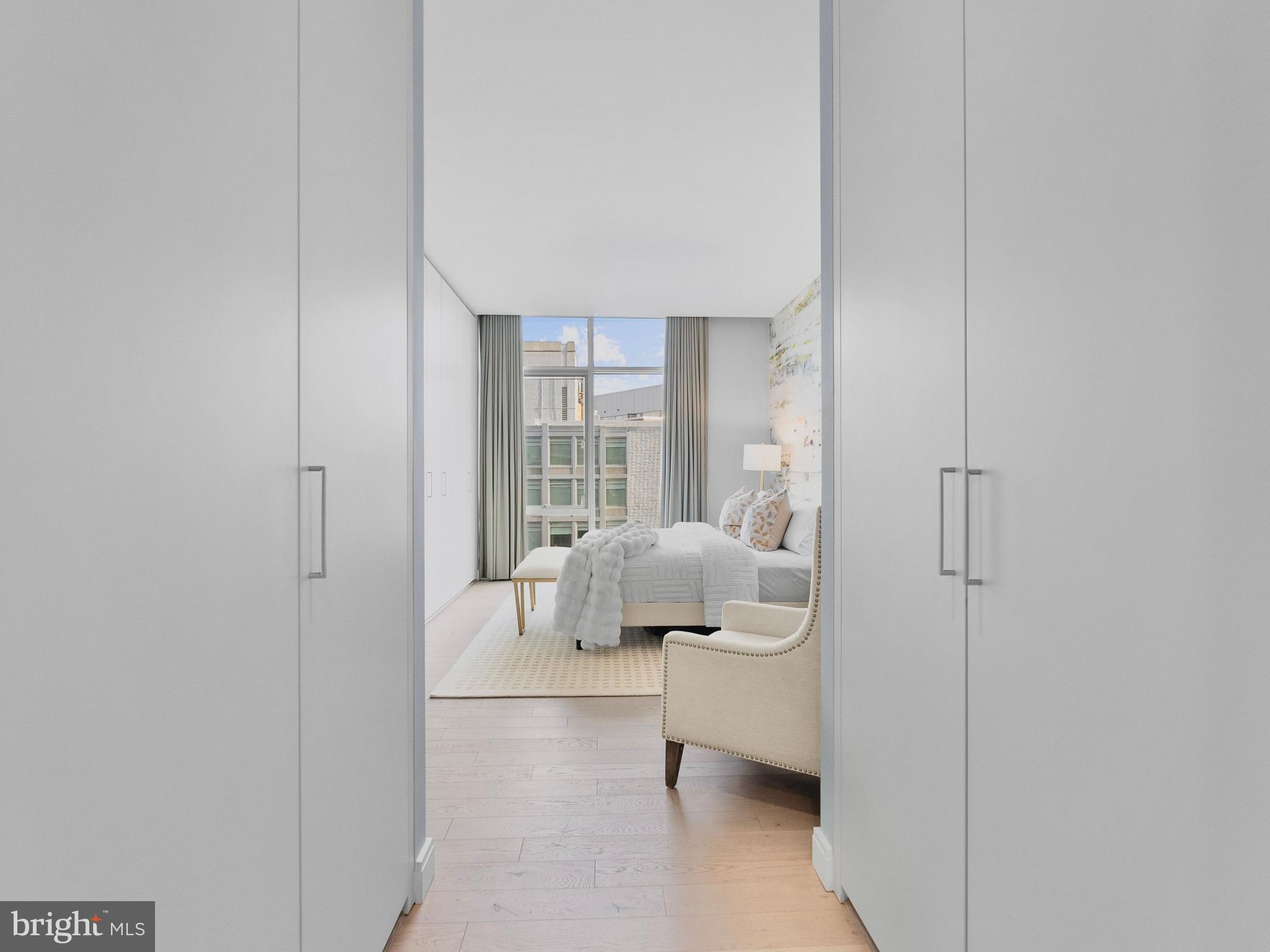 1177 22nd Street Northwest, Unit 7D Washington, DC 20037 - Photo 12 of 29 a living room with furniture and a large window