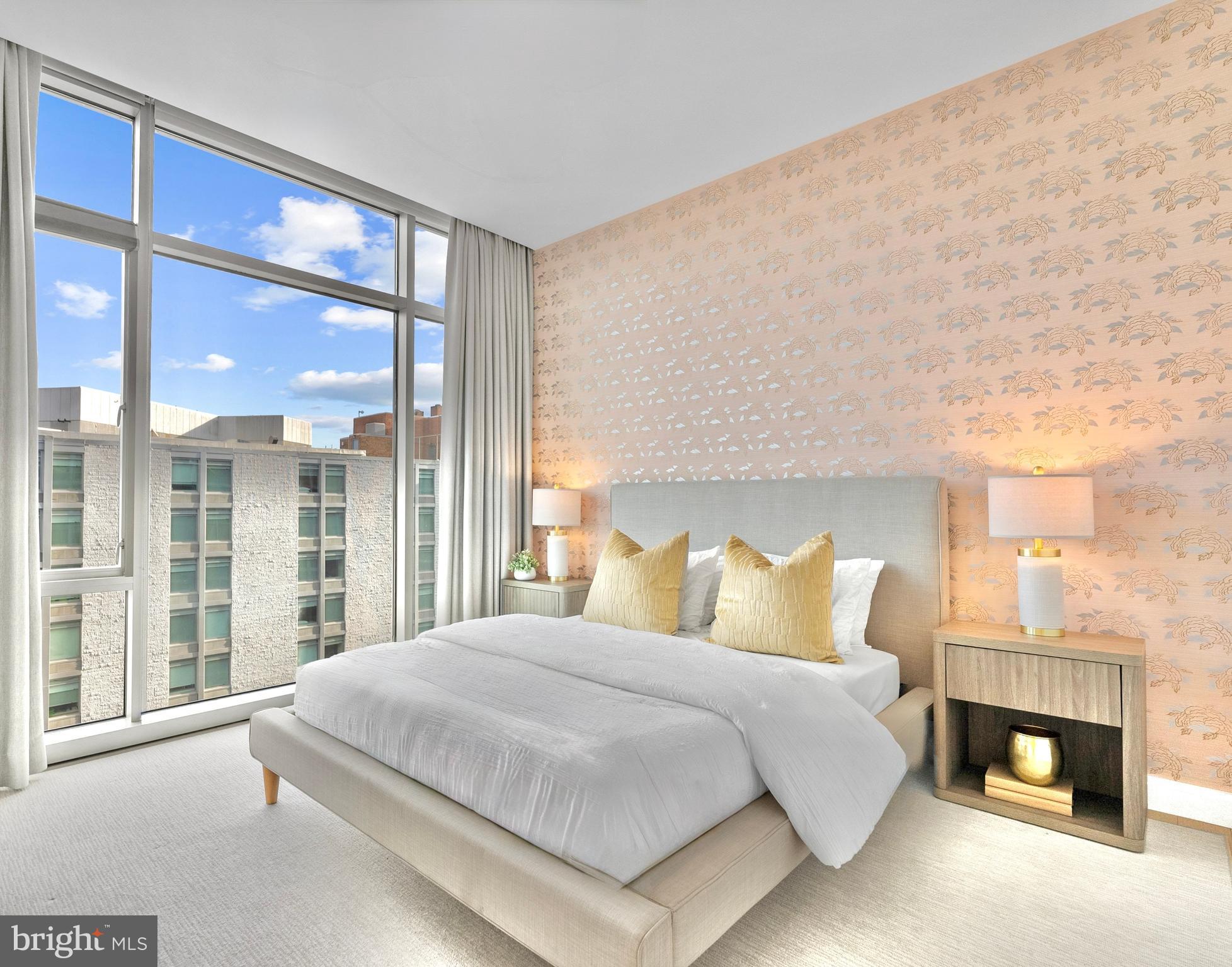 1177 22nd Street Northwest, Unit 7D Washington, DC 20037 - Photo 15 of 29 a bedroom with a large bed and a night stand