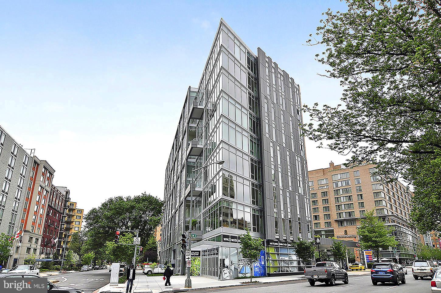 1177 22nd Street Northwest, Unit 7D Washington, DC 20037 - Photo 19 of 29 a city street lined with buildings and trees