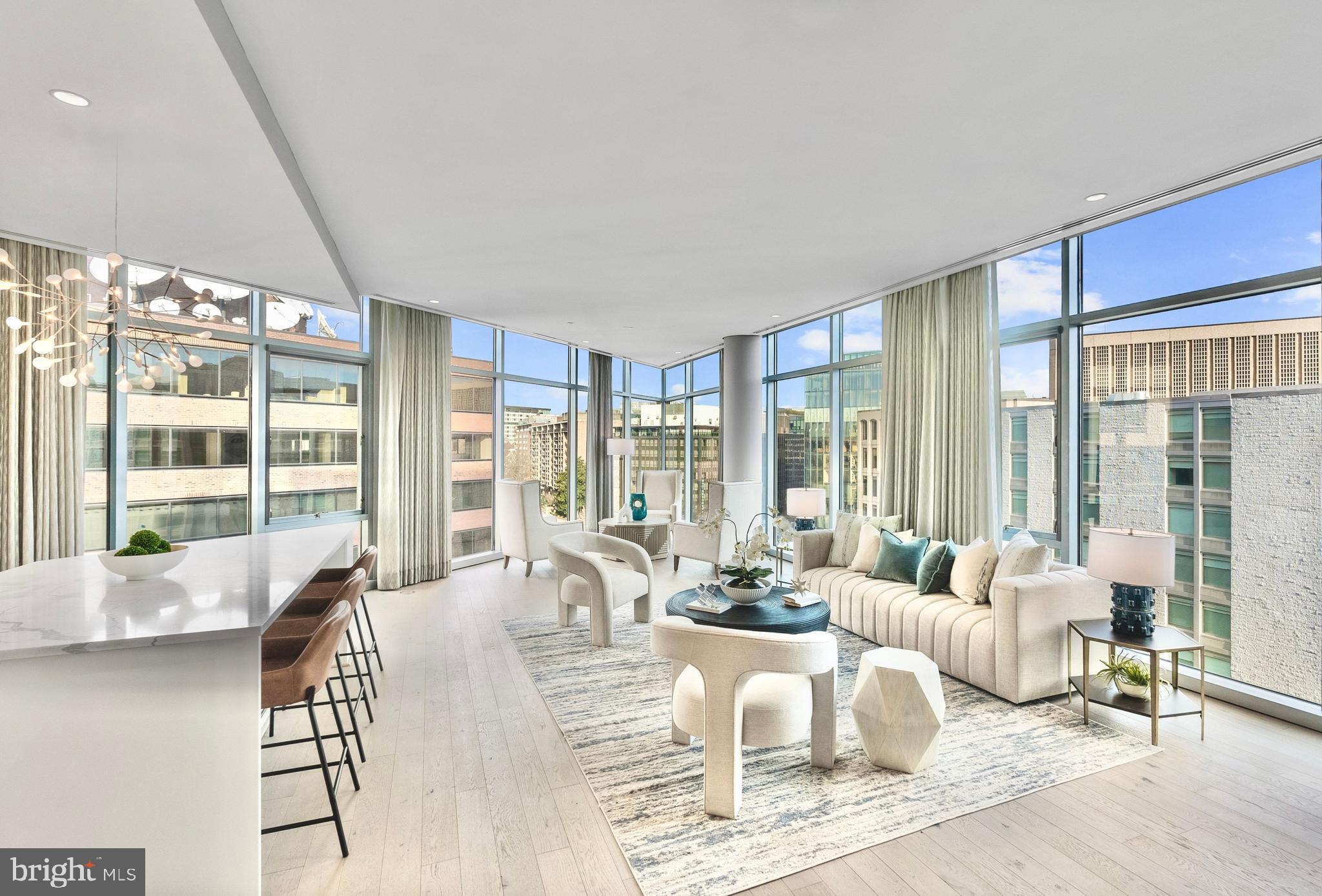 1177 22nd Street Northwest, Unit 7D Washington, DC 20037 - Photo 3 of 29 a living room with furniture and large windows