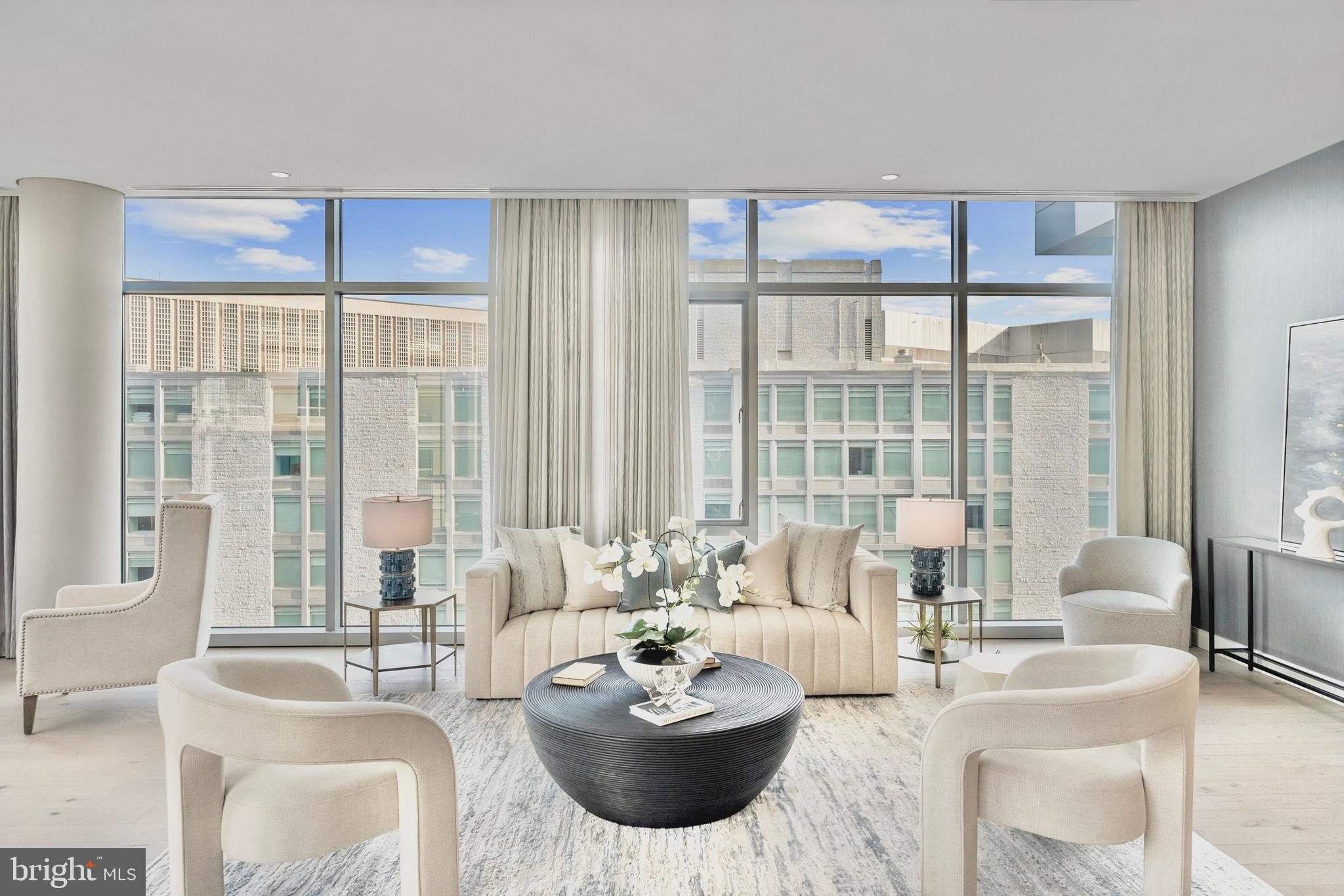 1177 22nd Street Northwest, Unit 7D Washington, DC 20037 - Photo 4 of 29 a living room with furniture and a large window
