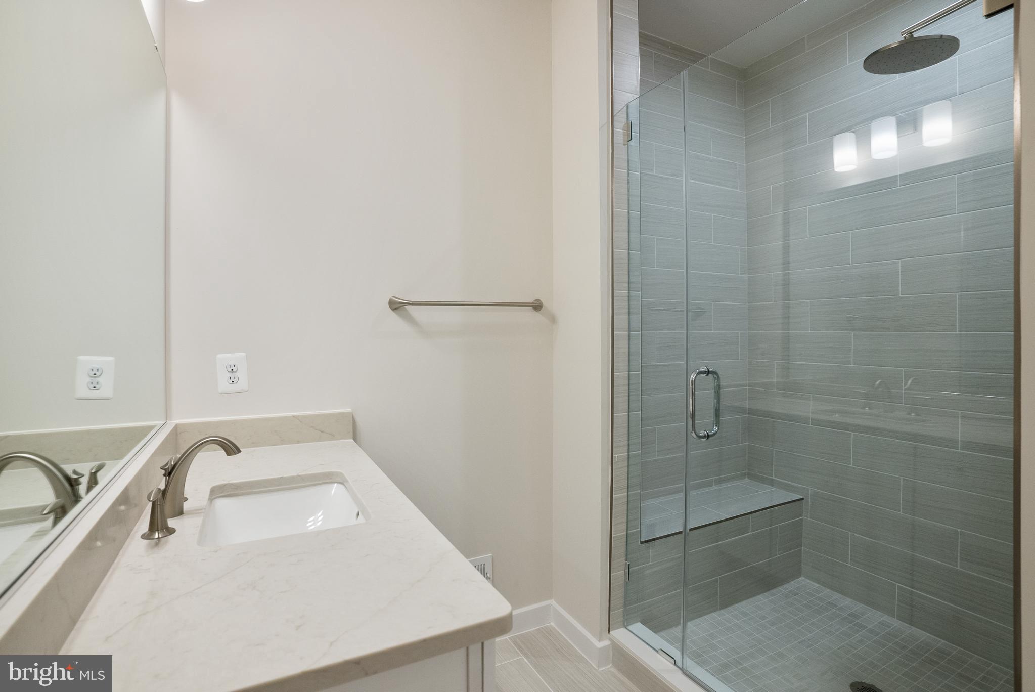 6701 Belcrest Road Hyattsville, MD 20782 - Photo 20 of 29 a bathroom with a sink a toilet and shower
