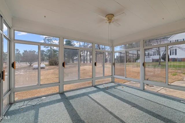 a view of a room with floor to ceiling windows