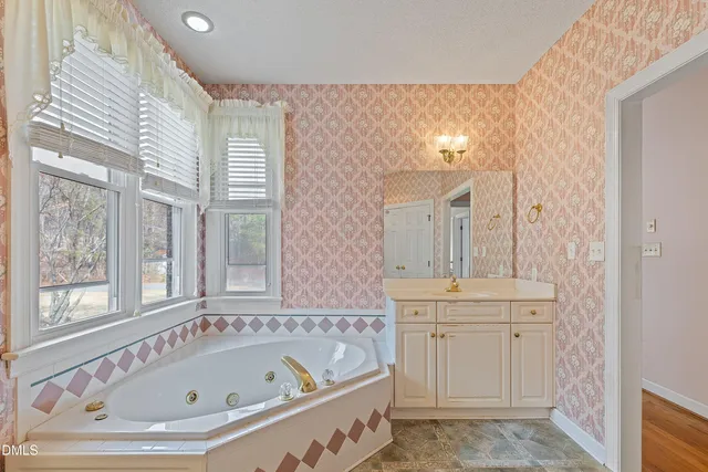 a bathroom with a bathtub and a sink