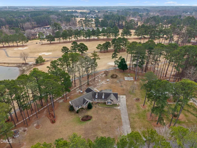 an aerial view of residential building and lake