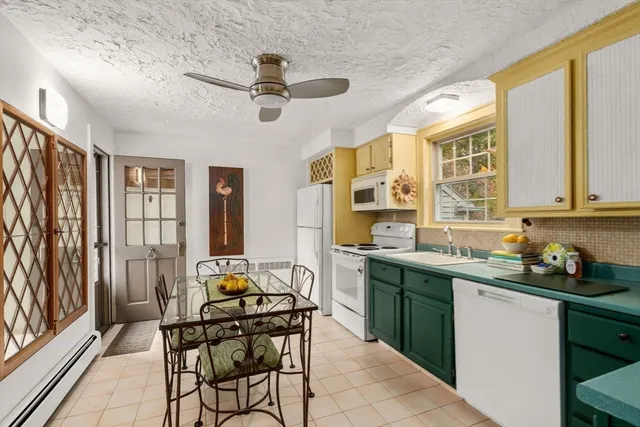 a kitchen with stainless steel appliances a sink stove and cabinets
