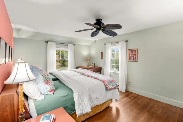 a bed room with a bed and a window