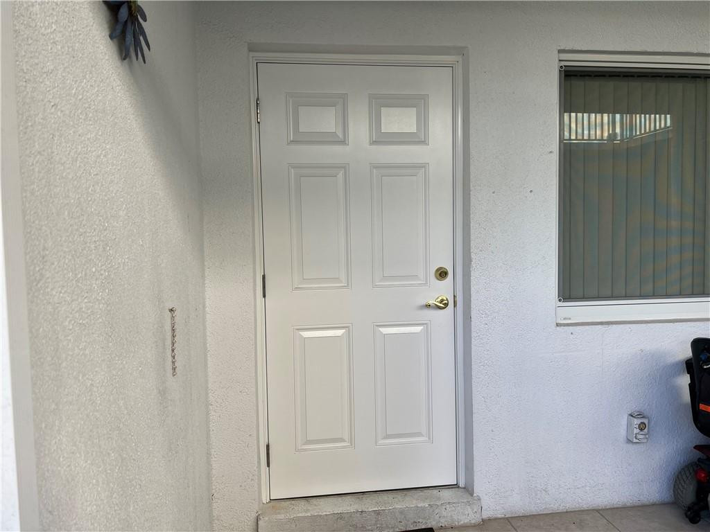 2100 Northeast 38th Street, Unit 124 Lighthouse Point, FL 33064 - Photo 12 of 30 a view of front door