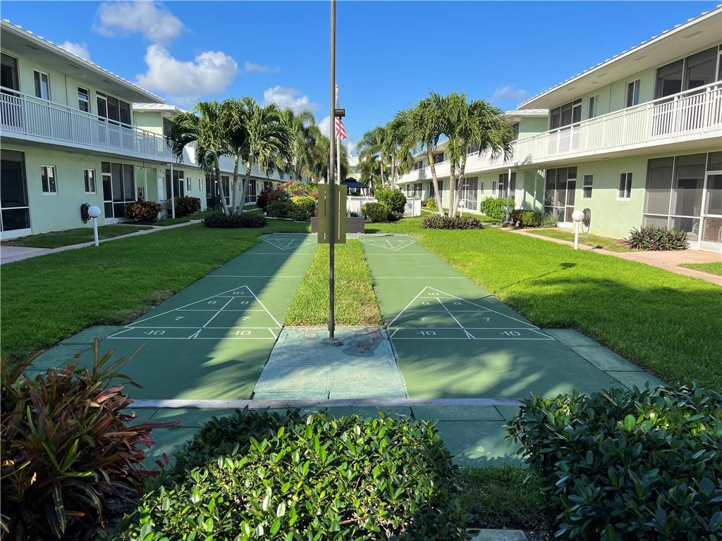 2100 Northeast 38th Street, Unit 124 Lighthouse Point, FL 33064 - Photo 15 of 30 a view of a house with a yard