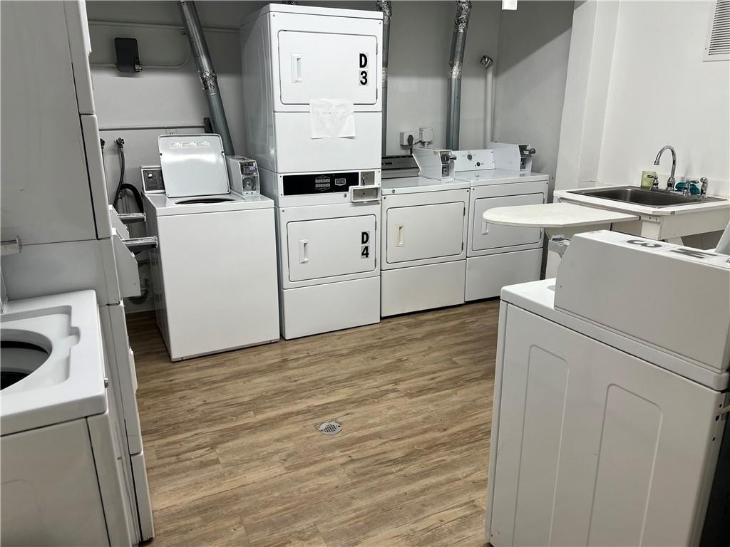 2100 Northeast 38th Street, Unit 124 Lighthouse Point, FL 33064 - Photo 20 of 30 a room with dryer and washer