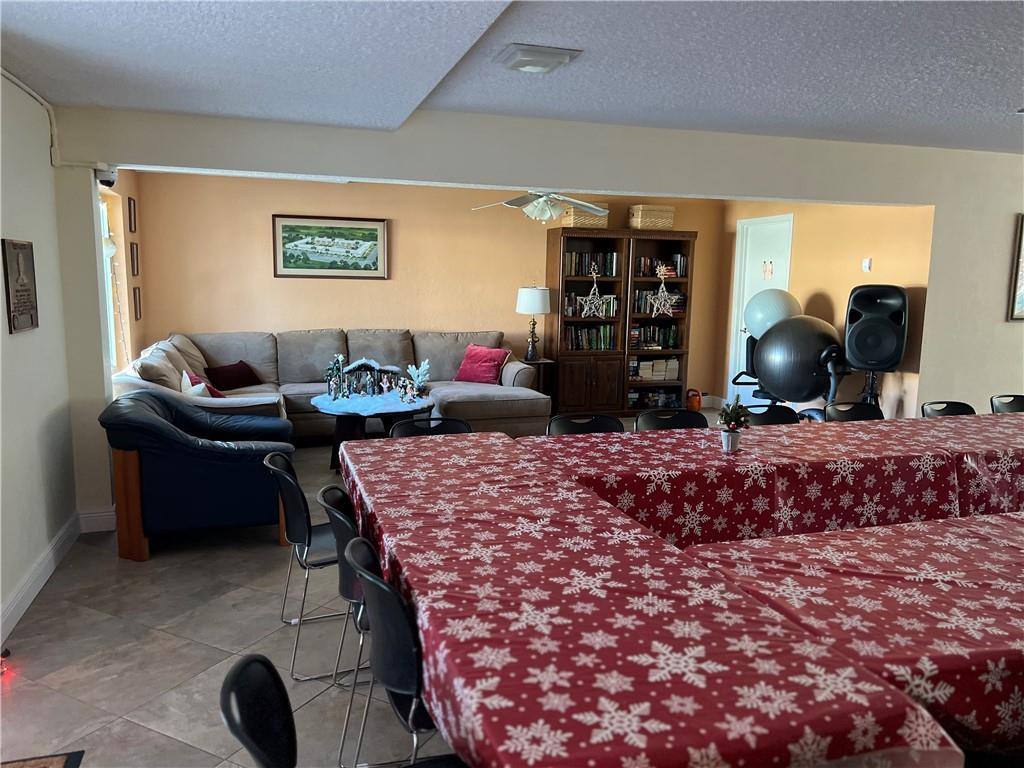 2100 Northeast 38th Street, Unit 124 Lighthouse Point, FL 33064 - Photo 24 of 30 a living room with furniture