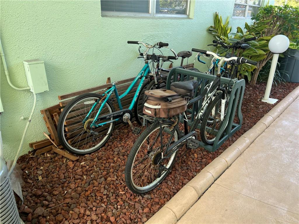 2100 Northeast 38th Street, Unit 124 Lighthouse Point, FL 33064 - Photo 25 of 30 a utility room with multiple dryer and bicycles