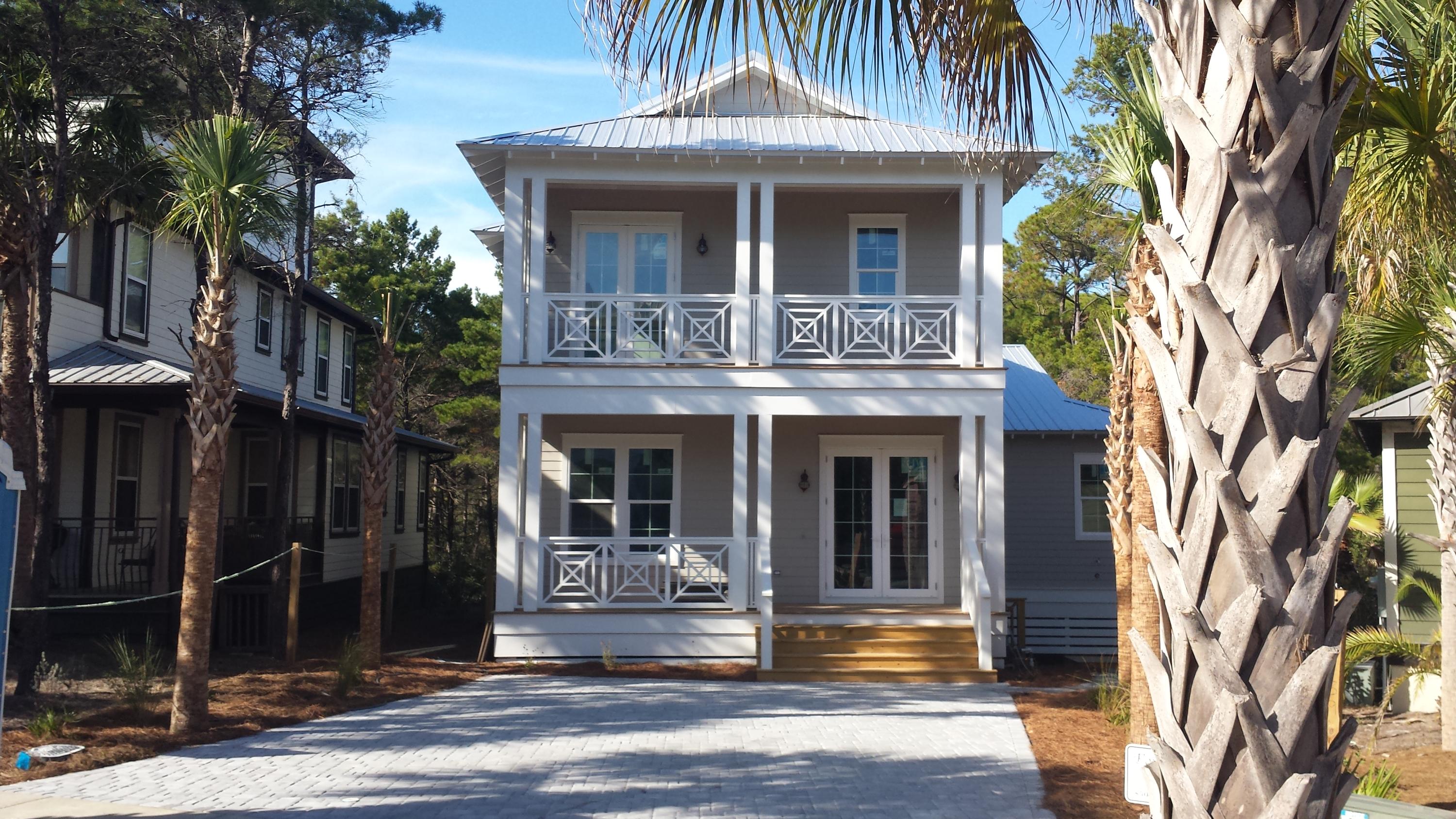 39 Lifeguard Loop Seacrest, FL 32461 - Photo 1 of 59 a front view of a house with garden