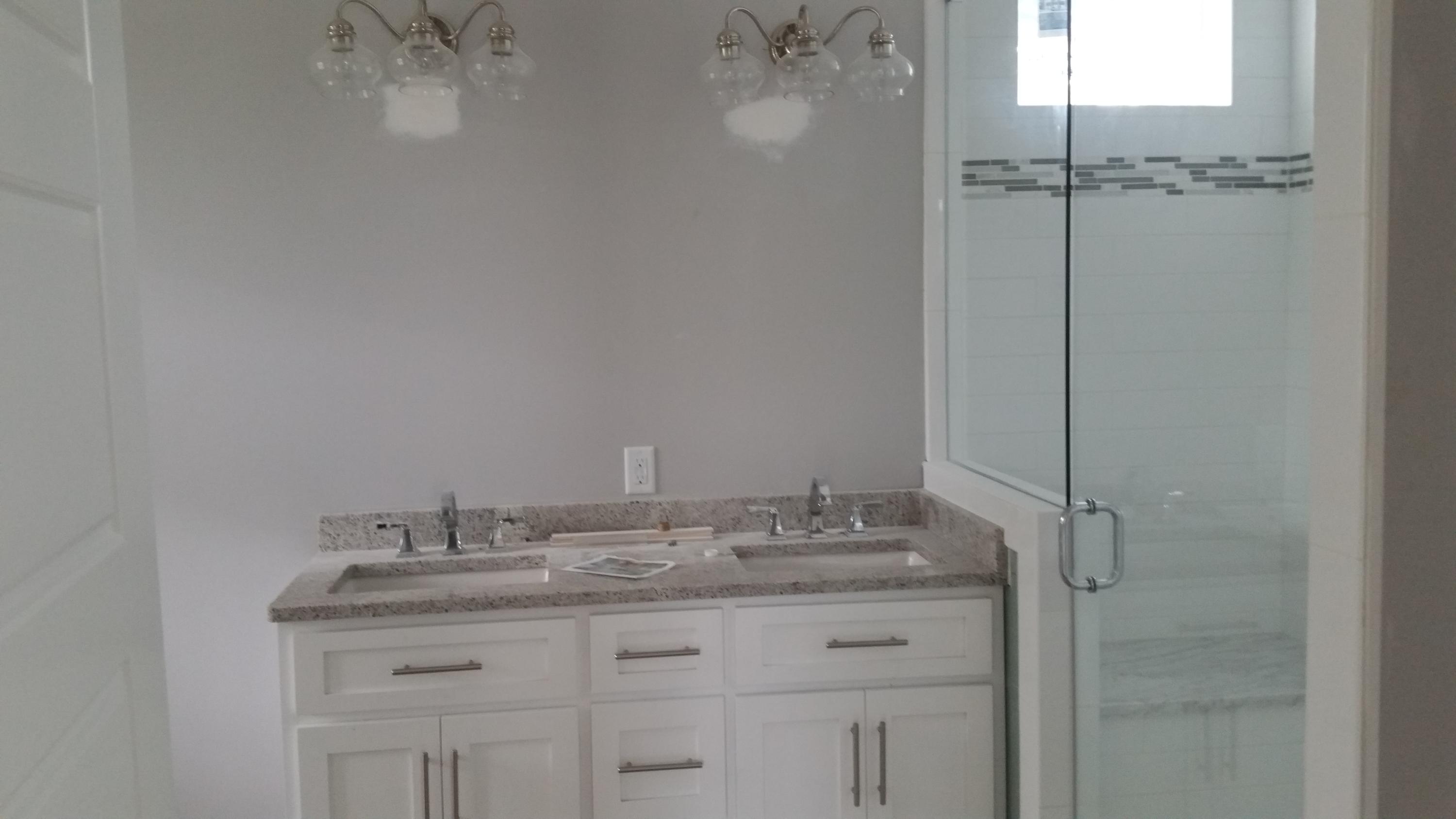 39 Lifeguard Loop Seacrest, FL 32461 - Photo 11 of 59 a bathroom with a granite countertop sink a mirror and shower