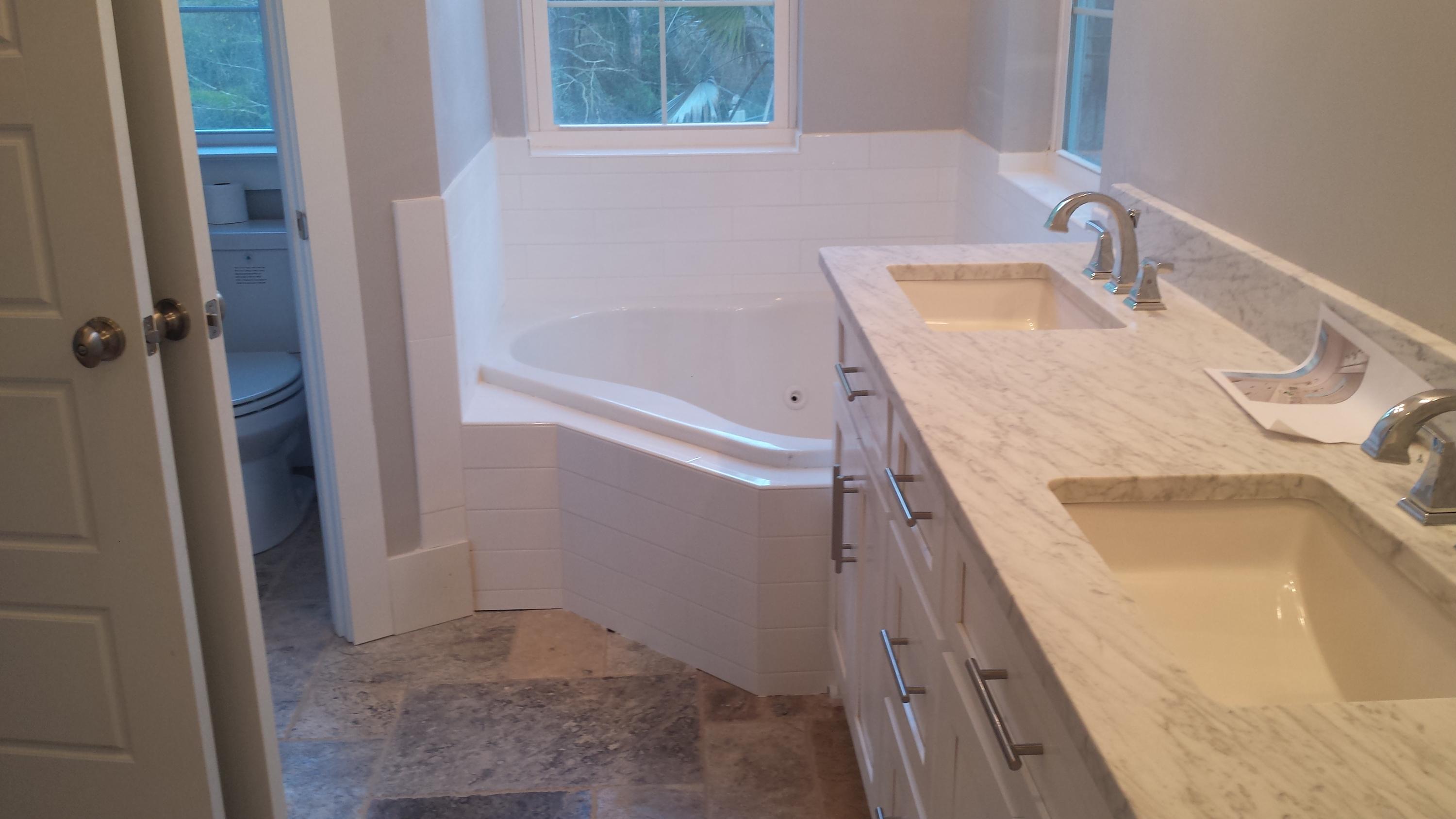 39 Lifeguard Loop Seacrest, FL 32461 - Photo 25 of 59 a bathroom with a tub sink and mirror