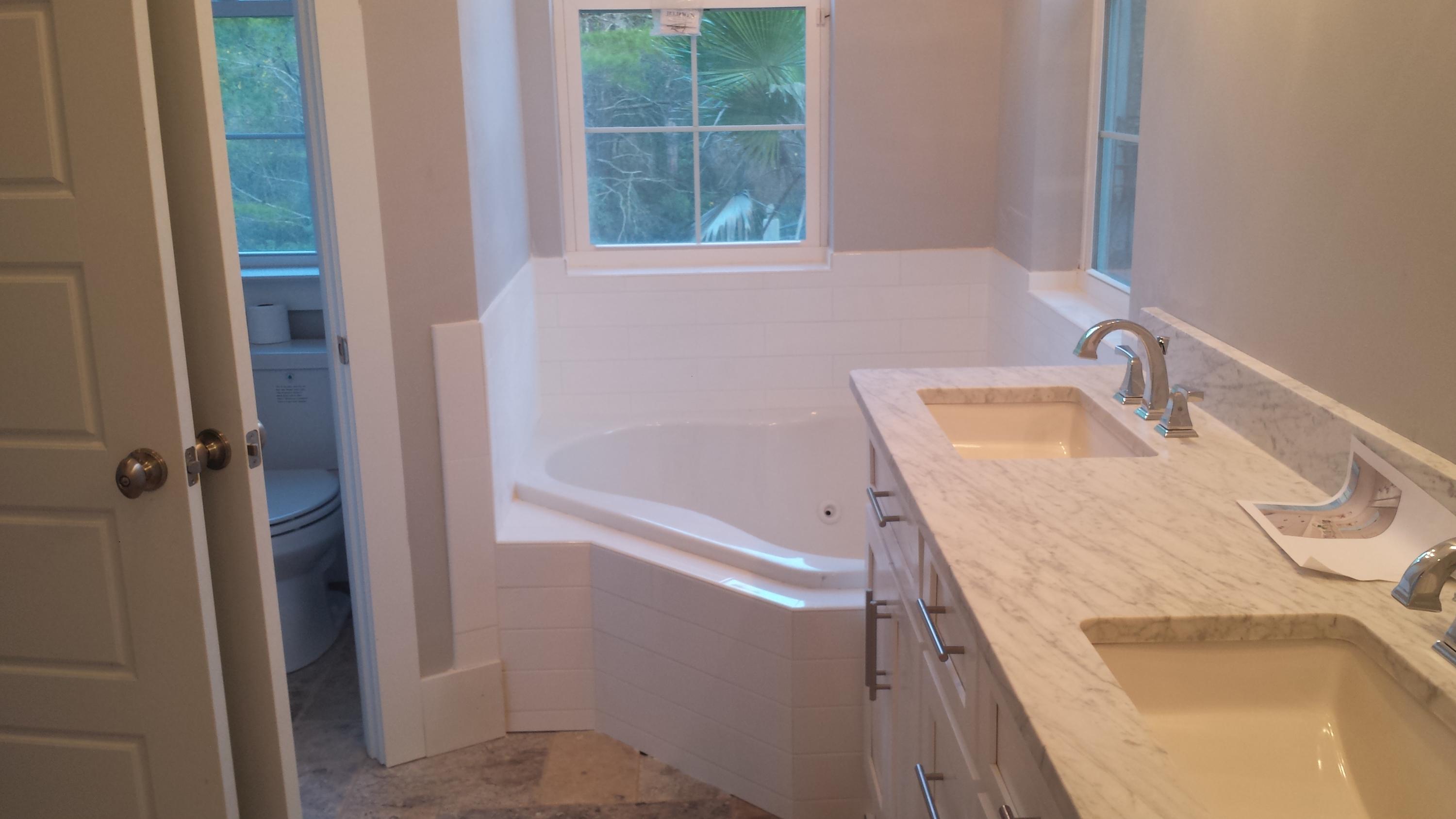 39 Lifeguard Loop Seacrest, FL 32461 - Photo 3 of 59 a bathroom with a tub sink and mirror